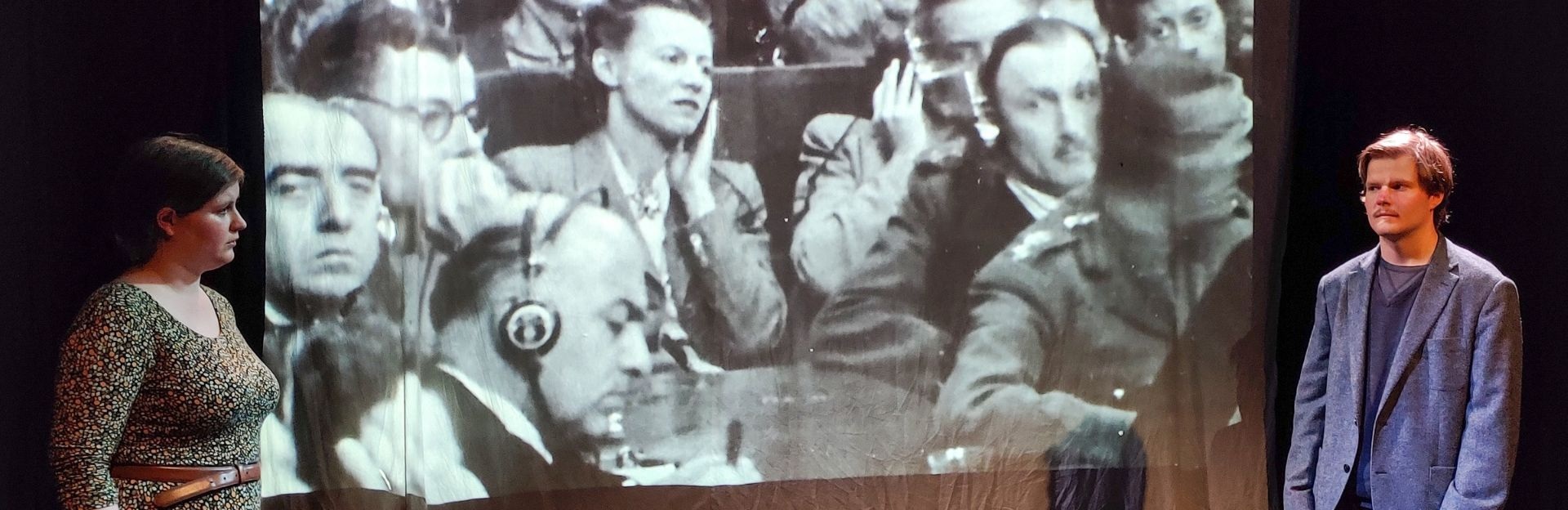 actors in front of Nuremberg footage